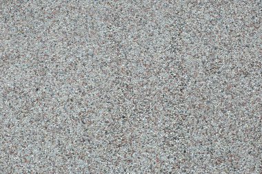 Taş bir beton duvarın yatay arka planı. Güzel taştan yapılmış dekoratif bir duvar.