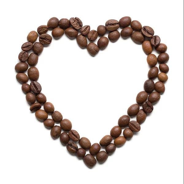 Roasted coffee beans placed in shape of heart — Stock Photo, Image