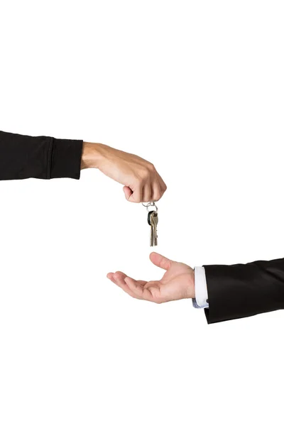 Enerzijds overhandigen van de sleutels tot een andere hand — Stockfoto