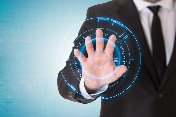 Businessman pressing on virtual button with full hand