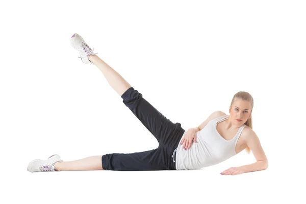 Young lady with sportive body doing exercise Stock Photo