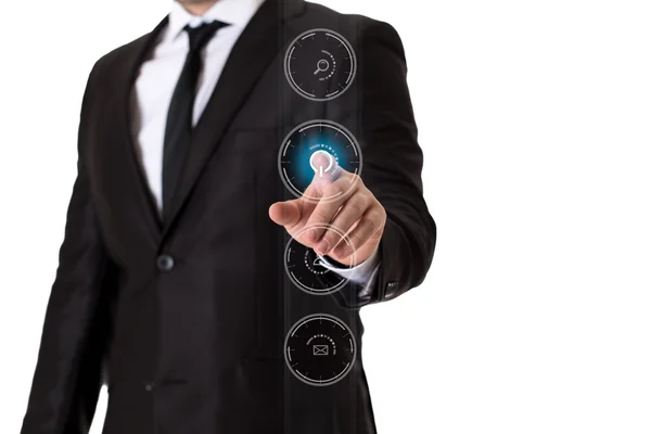 Бизнесмен в черном костюме нажимает кнопку виртуальных медиа Лицензионные Стоковые Изображения