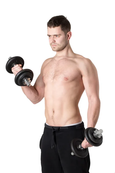 Musculoso joven levantando pesas. Aislado sobre blanco — Foto de Stock