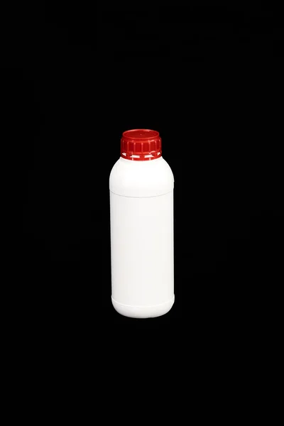 White empty plastic bottle with red cap — Stock Photo, Image