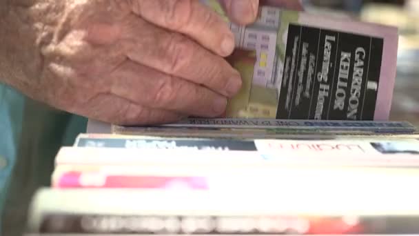 Man selecting book — Stock Video