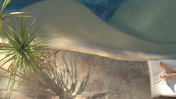 Woman sunbathing at pool — Stock Video