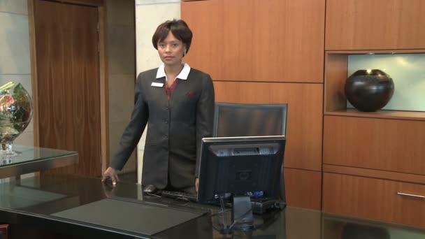 Receptionist standing at working place — Stock Video