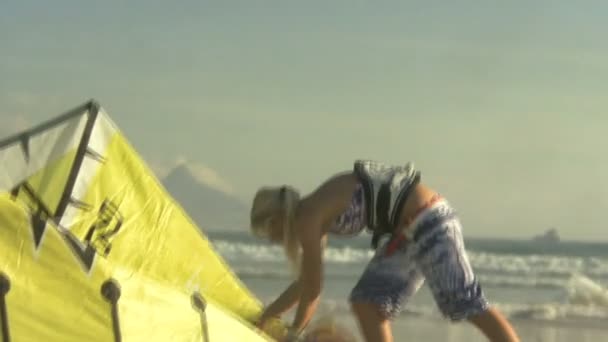 Woman carrying kite board — Stock Video