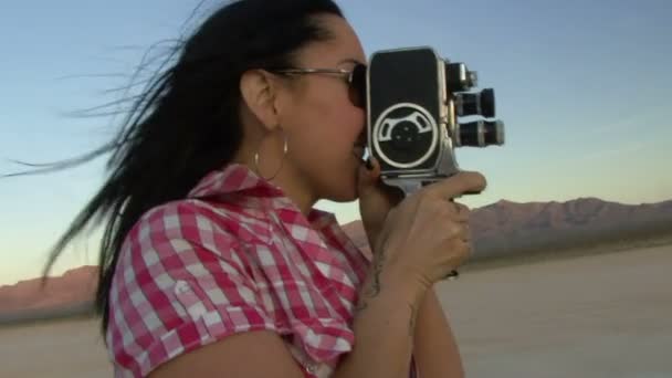 Female using a cine camera — Stock Video