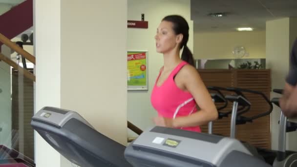 Group running on treadmills — Stock Video