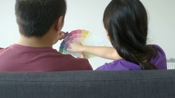 Couple choosing colour swatch — Stock Video