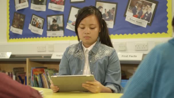 Schoolgirl using digital tablet — Stock Video