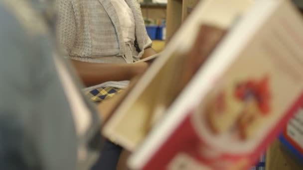 Schoolgirls reading books — Stock Video