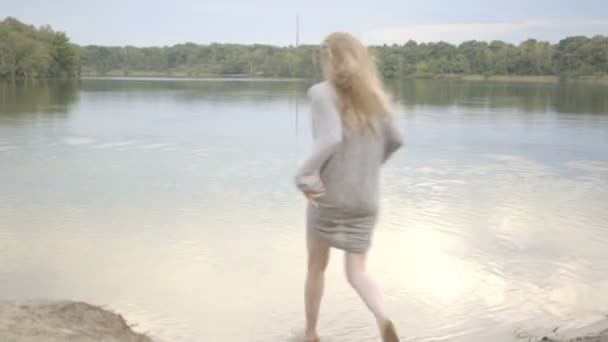 Woman running in water — Stock Video