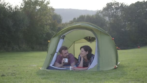 Couple lying in dome tent — Stock Video