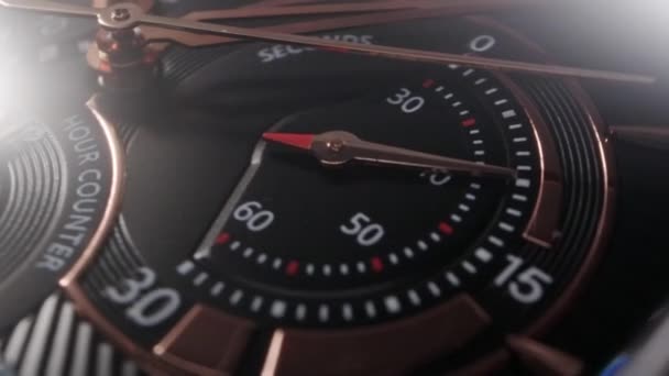 Rotující černý chronograf se zlatými detaily — Stock video