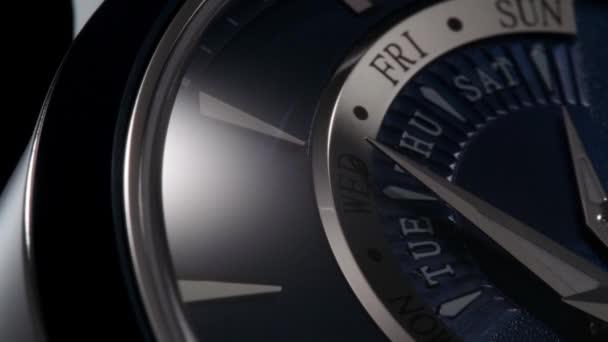 Light flash on the calendar on blue ceramic watch — Stock Video