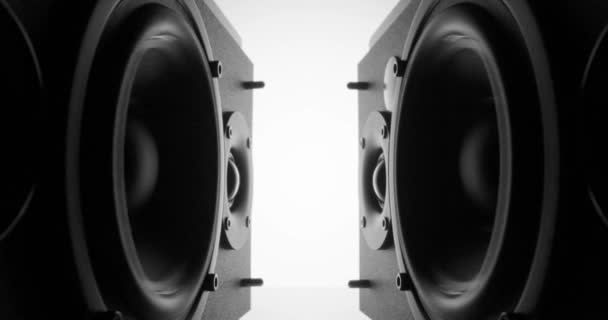 Sliding between two lying speakers with vibrating bass — Stock Video