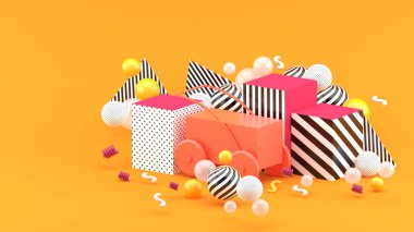 Kutuların arasındaki pembe araba ve turuncu arka plandaki renkli toplar..