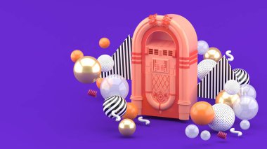 Mor arkaplandaki renkli toplar arasında pembe müzik kutusu.