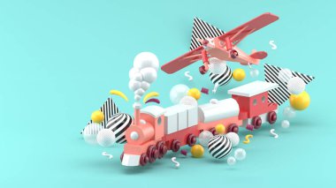 Pembe oyuncak tren ve uçak mavi arka plandaki renkli topların arasında..
