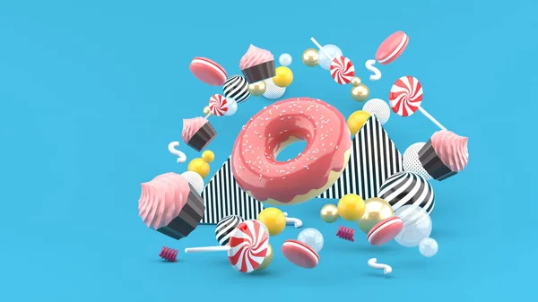 Donut ,Cupcakes ,Macaron,Candy floating among colorful balls on a blue background.-3d render.