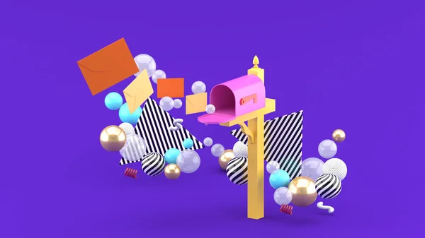 A floating letter from a mailbox surrounded by colorful balls on a purple background.-3d rendering.