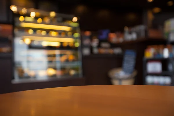 Empty round table top at coffee shop blurred background with bok — Stock Photo, Image