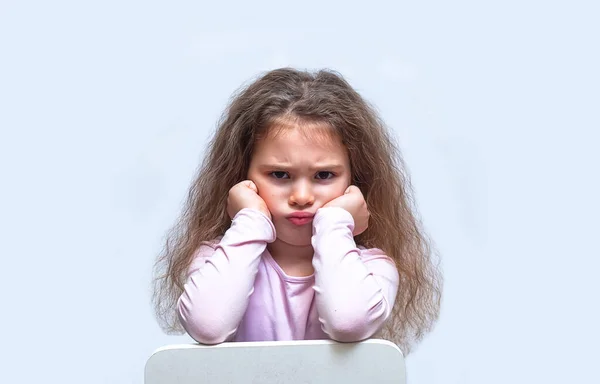 Upset brown-haired fringe hairstyle small girl pucker up her mouth feel upset