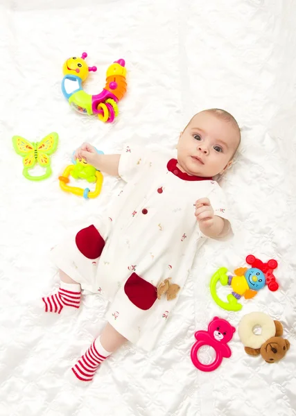 Sweetest baby girl playing with a colorful  toy — Stock Photo, Image