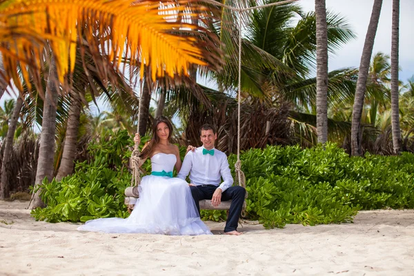 Young loving couple on the swing — Stock Photo, Image