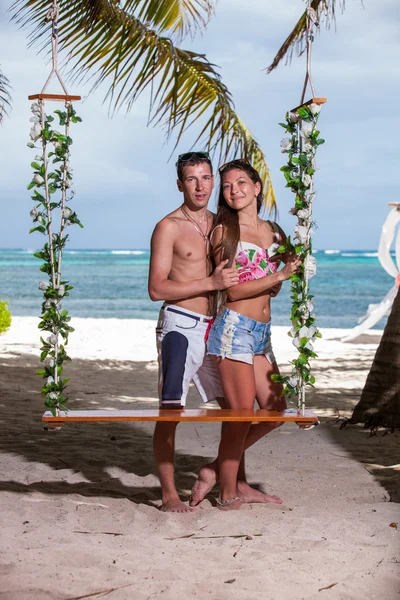 Young loving couple on the swing — Stock Photo, Image