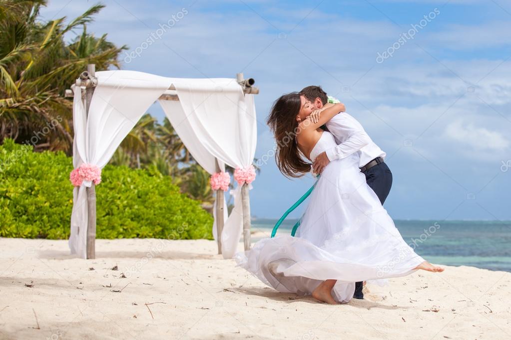 Young loving couple wedding in gazebo.