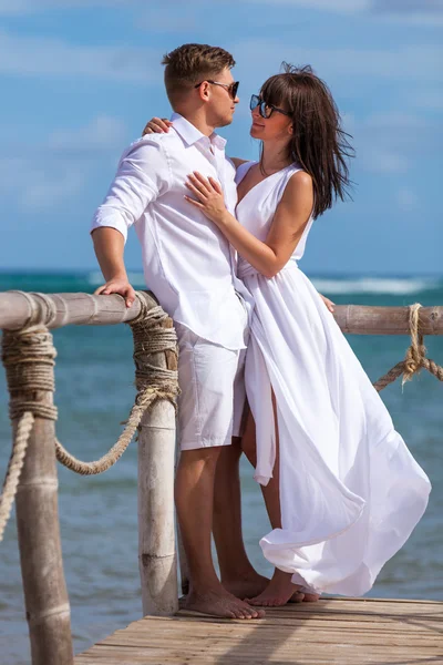 Bride and groom together on a wharf — Stock Photo, Image