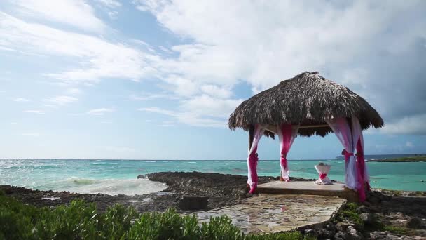 Wedding gazebo on the ocean reef shore — Stock Video
