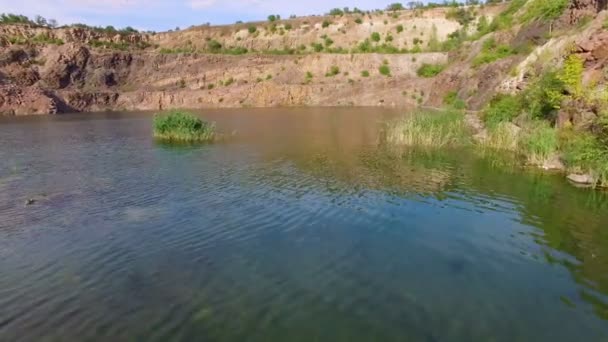 Aerial: flying over the lake, mountains. — Stock Video