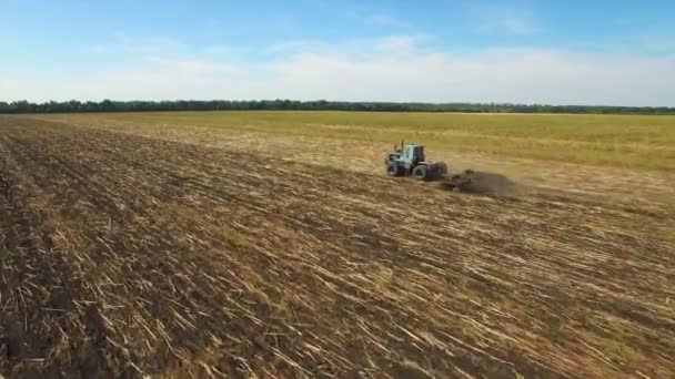Aerial: Tractor plowing the soil — Stock Video