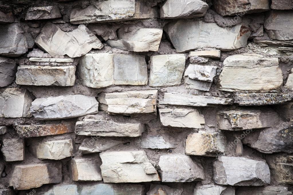 Medieval wall made from stones — Stock Photo © vladmilkov 85229220