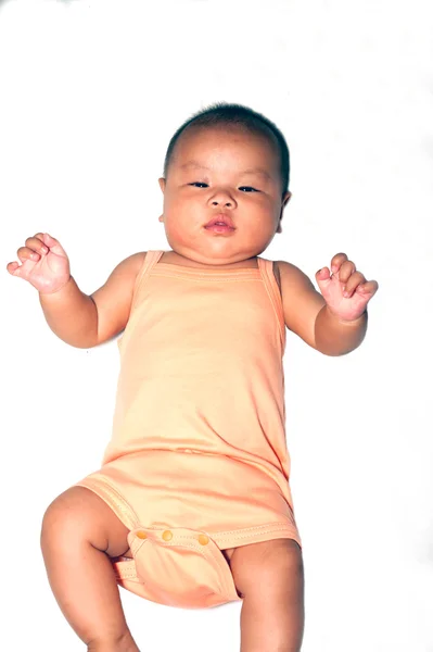 Newborn Asian baby girl lying on a bed. — Stock Photo, Image