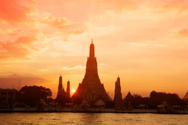 Large pagoda of the Buddhist temple is Wat Arun a famous landmark of Thailand in Bangkok capital city on sunset.