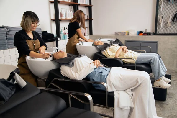 Hairdresser Washes Hair Customer Barber Shop Women Lying Chair Robe — Stock Photo, Image