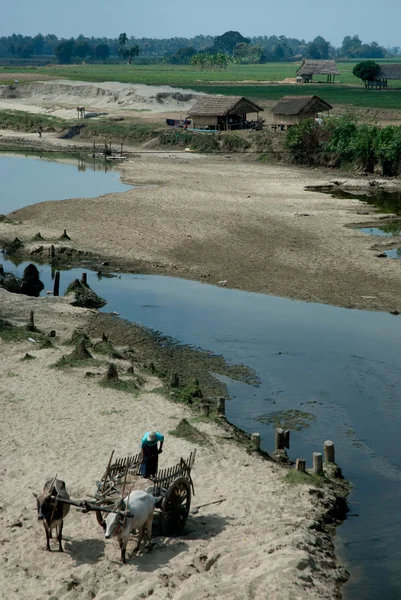 Sand cart carry near river . — Stock Photo, Image