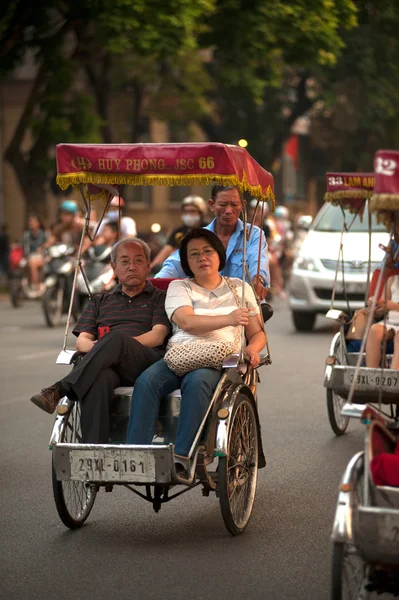 Tourist taking a cycro ride. — Stock Photo, Image