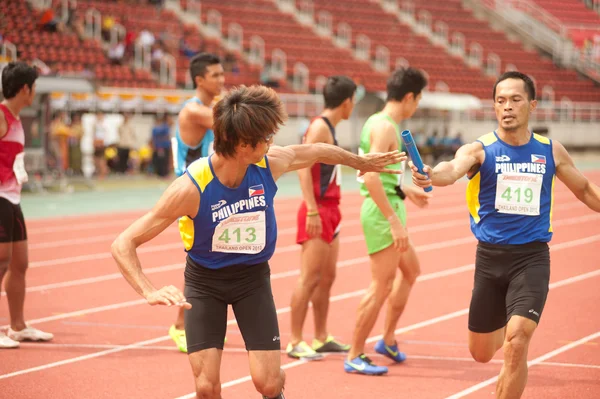 Relay in Thailand Open Athletic Championship 2013. — Stock Photo, Image