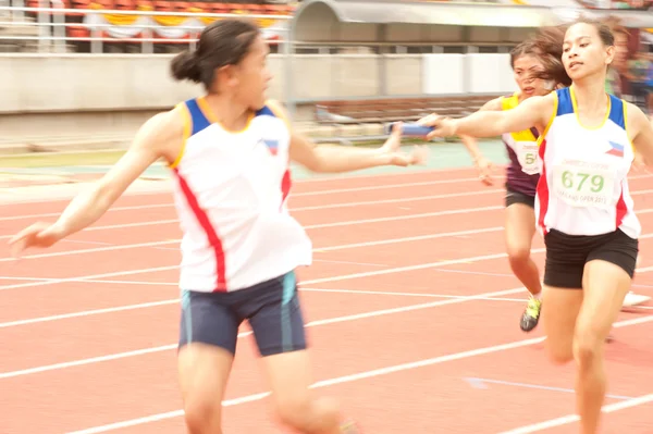 Relay in Thailand Open Athletic Championship 2013. — Stock Photo, Image