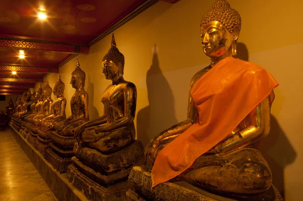 Group of Buddhas in the wall at church . — Stock Photo, Image