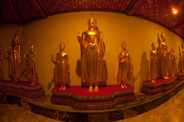 Group of Buddhas in the wall at church . — Stock Photo, Image