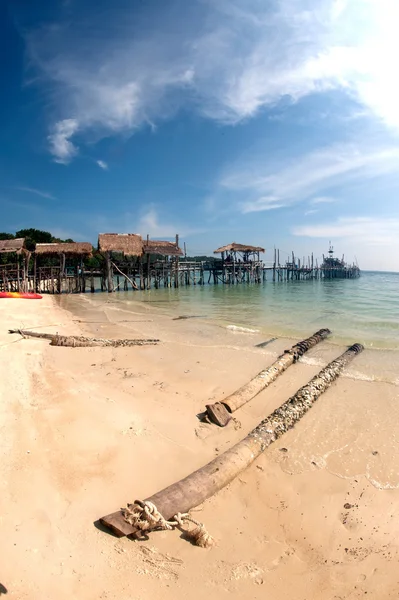 Beach and traditional wooden bridge. — Stock Photo, Image