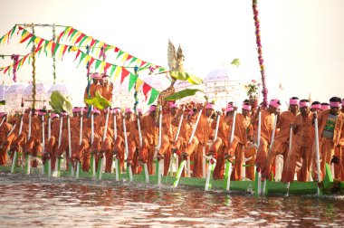 Peoples paddle by legs in Phaung Daw Oo Pagoda festival,Myanmar.
