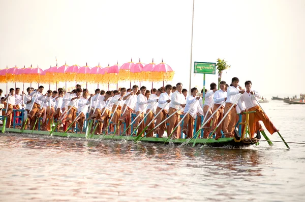 Peoples paddle by legs in Phaung Daw Oo Pagoda festival,Myanmar.